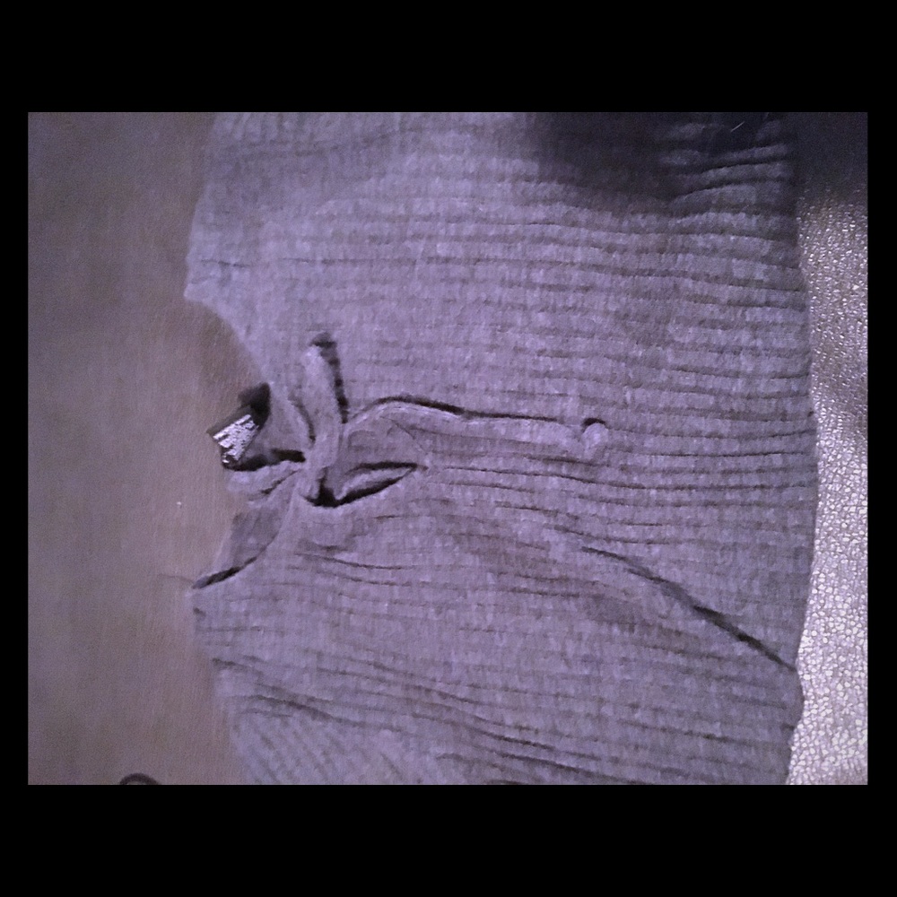 All grey shirt with a bow in the front